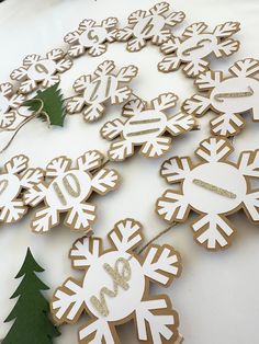 snowflake cookies are arranged in the shape of letters and numbers on a table