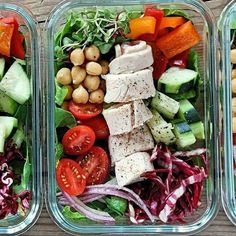 three plastic containers filled with different types of vegetables and meats on top of each other