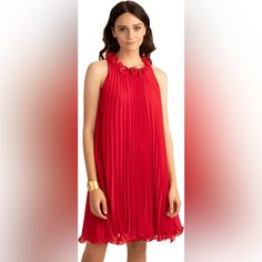 The Trina Turk Ely Dress Adds A Playful Attitude To Your Wardrobe With A Ruffled Neckline And Accordion Pleats Throughout. Refresh Your Party Look With This Bright Red Dress, Sure To Be A Standout At Every Occasion. Pleated A-Line Dress With Pull-On Design. A-Line Silhouette. Ruffled Neckline. Accordion-Pleated Overlay Do Not Steam Or Iron. Lined. 100% Polyester. Dry Clean Only. Imported. Red Pleated Chiffon Dress, Flowy Pleated Mini Dress For Party, Flowy Chiffon Pleated Dress For Party, Red Chiffon Formal Dress, Flowy Sleeveless Pleated Dress For Parties, Sleeveless Chiffon Pleated Dress For Party, Sleeveless Chiffon Pleated Party Dress, Elegant Flowy Pleated Dress, Elegant Flowy Pleated Dress For Party