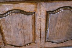 an old wooden cabinet with two doors on the front and one door open to show woodgrain