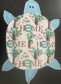 a paper plate with a turtle and flowers on it