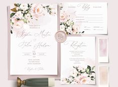 wedding stationery with flowers and wax stamp on it, next to a bottle of wine