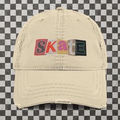 Skater approved! Expand your headwear collection with this fashionable dad hat. With a slightly distressed brim and crown fabric, it'll add just the right amount of edge to your look. For a quick and easy outfit pair it with slacks, your favorite jeans, and a sports tee. * 100% pre-shrunk cotton twill * Soft crown * 6 sewn eyelets * 6 stitched rows on the brim * 6-panel unstructured cap with a low profile * Seamed front panel without buckram * Adjustable hook and loop closure * Blank product sourced from China This product is made especially for you as soon as you place an order, which is why it takes us a bit longer to deliver it to you. Making products on demand instead of in bulk helps reduce overproduction, so thank you for making thoughtful purchasing decisions! Cheap Adjustable Hats With Letter Print, Cut Out Letters, Sports Tee, Easy Outfit, Sport T-shirts, Dad Hat, Hook And Loop, Favorite Jeans, Trucker Cap