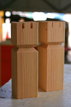 two wooden blocks sitting on top of a table