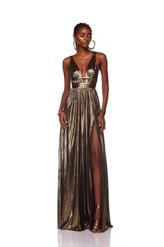 Embrace divine elegance in our Goddess Gown, featuring a captivating deep V-neck and a flattering belted waist. Crafted from lightweight metallic fabric and partially lined for comfort, it boasts a hidden back zipper closure and a mesmerizing split hem, perfect for any special occasion. Bronx And Banco Dresses, Goddess Gown, Bronx And Banco, Gold Maxi Dress, Gown Gold, Career Girl, Gold Gown, Michael Costello, One Shoulder Gown