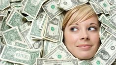 a woman is surrounded by money in the shape of a face and eyes, looking up at the camera