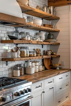 a kitchen with white cabinets and open shelving