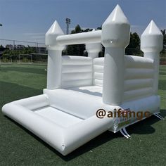 an inflatable castle is on the grass