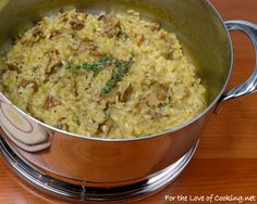 a large pot filled with food on top of a wooden table