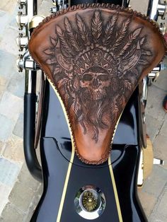 the back end of a motorcycle with a tattoo on it