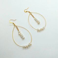 Drop earrings , long earrings , gold pearl earrings , raw pearl earrings , dangle earrings , statement earrings , gold dainty earrings , wire earrings , teardrop gold earrings I made those beautiful earrings trying to make something unique and classic. They are dainty and dangle earrings and also so elegant. With the gold filled stainless steel wire and the raw pearl beads the outcome is so classy that sends you to another level a unique style is given. They are the perfect gift to treat yoursel Long Gold Earrings, Gold Pearl Earrings, Dainty Earrings, Wire Earrings, Gold Pearl, Long Earrings, Teardrop Earrings, Pearl Beads, Girlfriend Gifts