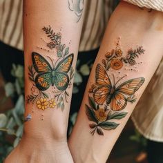 two women with matching tattoos on their arms, both have butterflies and flowers on them