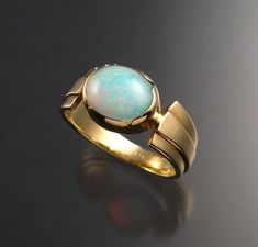 Opal Ring 14k Gold Oval Size 8 3/4 | Etsy Vietnam Oval Cabochon Opal Ring With Polished Finish, Formal Oval Cabochon Opal Ring, Modern Yellow Gold Oval Opal Ring, Modern Oval Yellow Gold Opal Ring, Modern Oval Opal Ring For Formal Occasions, Modern Oval Opal Ring In Yellow Gold, Luxury Polished Opal Ring, Oval Cabochon, Modern 14k Gold Oval Opal Ring, Luxury Polished Opal Ring With Oval Cabochon