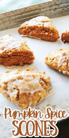 pumpkin spice scones on a baking sheet with the words, pumpkin spice scones