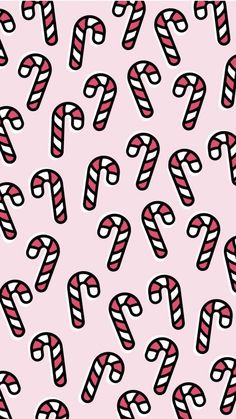 candy canes on a pink background with black and white lines in the middle,