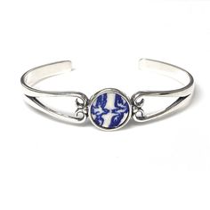 "9th Anniversary Gift for Wife, Blue Willow Love Birds Broken China Jewelry,Dainty Sterling Silver Cuff Bracelet Repurposed blue willow ware china plate. Lovebirds! Artfully repurposed from a vintage china plate. This cuff bracelet is delicate yet strong, easy to slip on and a very comfortable fit. Sterling silver cuff bracelet is shiny silver with lightly antiqued details. Circle setting measures .5\" wide. One size fits most, from teenage to adult. Set in sterling silver for a beautiful, timel Gift White Gold Cuff Bracelet, White Gold Cuff Bracelet Gift, Adjustable Blue Cuff Bracelet For Anniversary, White Gold Round Cuff Bracelet For Anniversary, White Gold Cuff Jewelry For Anniversary, Nickel-free Classic Bangle As Gift, Classic Nickel-free Bangle As Gift, White Gold Cuff Bracelet For Gift, Blue Round Cuff Bracelet For Formal Occasions