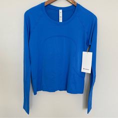 Nwt Lululemon Swiftly Tech Long Sleeve 2.0 *Race Length Pipe Dream Blue Size 8 Lululemon Swiftly Tech Long Sleeve Blue, Long Sleeve Lululemon Top, Lulu Long Sleeve Shirt, Blue Athleisure Activewear With Thumbholes, Lulu Lemon Tops, Lululemon Colors, Lulu Wishlist, Lulu Swiftly Tech, Lululemon Clothes