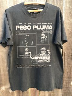 Vintage Peso Pluma 90s Shirt, Peso Pluma Exodo Tour 2024 Shirt, Peso Pluma Tour Merch Shirt, Gift For Men Women All t-shirts are custom made to order and are printed using the latest ink to garment technology, a technology superior to heat transfer or screen print. - Heather colors are 52% combed and ring-spun cotton, 48% polyester - Athletic and Black Heather are 90% combed and ring-spun cotton, 10% polyester - Solid Colors 100% pre-shrunk cotton - Fiber content may vary by color FOR THE BEST F Merch Shirt, 90s Shirts, Tour Merch, Retro Shirts, Tour Shirt, Graphic Shirt, Graphic Shirts, Screen Print, Cotton Fiber