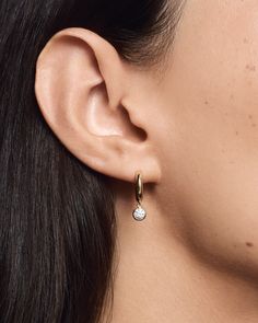 Each modern, rounded 14k gold hoop is elevated by a delicate ¼ ct lab-grown diamond that moves fluidly with you, catching the light from all angles. Diamond Icon, Halo Collection, Rock Gifts, Studded Necklace, Earring Sale, Travel Jewelry, Emerald Diamond, Gold Hoop, Jewelry Pouch