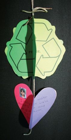 two paper hearts hanging from a string