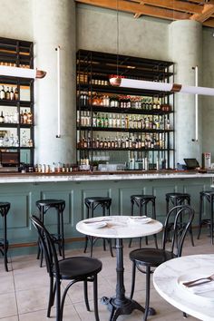 an empty restaurant with tables and chairs