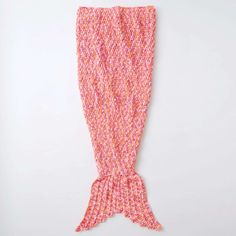 an orange and pink mermaid tail on a white background