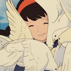 an animated image of a boy holding two white birds