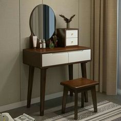 a dressing table with a mirror and stool