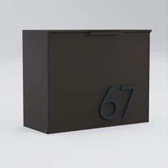 a black mailbox with the number sixty on it's front and side panels