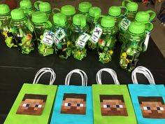 some bags and bottles on a table with minecraft tags attached to the bag handles