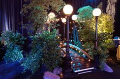 a set of stairs with lights and plants