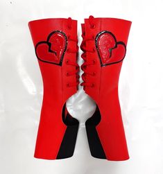 "\"Heartbreaker\" Short Red Aerial boots with Patent Broken Heart Applique PLEASE MAKE SURE TO REFER TO THE STANDARD SIZING CHART AND FITTING DOCUMENT TO FIND YOUR SIZE! -Shaft and Back tongue made of Red Cowhide leather -Back tongue is lined with Nappa leather -Broken Heart on each outside leg is made of soft Red Patent leather, rimmed with Black Patent leather  -Black Elastic panel under the foot is 3\"inch wide. -Height of the boots from floor to top edge is 9\" inches -The boots come with Re Aerial Boots, Aerial Costume, Clown Shoes, Heart Applique, Aerial Hoop, Red Eye, Soft Red, Boots Leather, Black Star