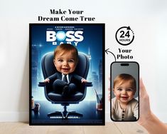 a person holding up a cell phone next to a poster with a baby on it