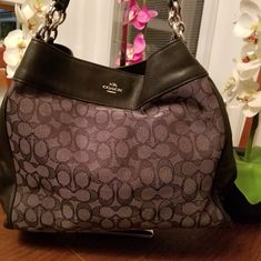 Excellent Condition Coach Shoulder Bag Gray And Black In Signature Canvas. Three Compartments With A Zipper Closure In The Middle. Very Clean Inside. Looks Like It Was Never Used. Classy Beautiful Bag! Questions? Leave A Comment Below! Reasonable Offers Are Welcome. Gray Shoulder Bag With Handles For Evening, Evening Gray Shoulder Bag With Handles, Chic Gray Shoulder Bag With Branded Hardware, Coach Gray Tote Shoulder Bag, Travel Gray Shoulder Bag With Branded Hardware, Gray Travel Shoulder Bag With Branded Hardware, Gray Shoulder Bag With Branded Hardware For Travel, Everyday Gray Coach Shoulder Bag, Chic Gray Shoulder Bag With Silver-tone Hardware