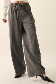 Solid twill pants. Drawstring elastic waist. Hip pockets. Wide leg. Pintuck detail. Full length. Loose fit. 70% Tencel, 25% Rayon, 5% Spandex. Imported. Designed in LA. Model wears size S. Twill Pants, Pin Tucks, Drawstring Pants, Mocha, Elastic Waist, Full Length, Wide Leg, Loose Fitting, Spandex