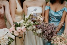 bridesmaids holding bouquets of flowers in their hands