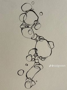 an ink drawing of bubbles and circles on paper