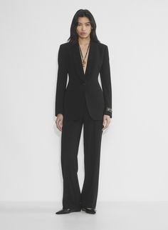 Timeless Long-sleeved Evening Blazer, Timeless Long Sleeve Evening Blazer, Sleek Semi-formal Pantsuit With Pressed Crease, Chic Formal Suits With Pressed Crease, Evening Pantsuit With Notch Lapel And Pressed Crease, Tailored Evening Blazer With Lapel Collar, Tailored Blazer With Lapel Collar For Evening, Luxury Lapel Collar Semi-formal Pantsuit, Chic Tailored Blazer For Formal Occasions