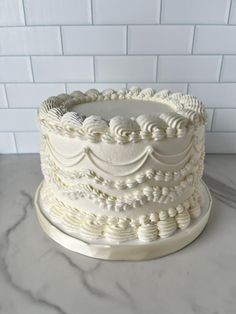 a white cake sitting on top of a counter