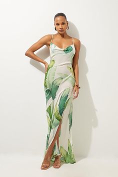 Feel Summer Ready In Our Maxi Dress, With A Bodycon Bodice That Falls To A Flowing Skirt, And A Unique Palm Print, Perfect For Long Walks From The Beach To The Tapas Bar. The Strappy Back Makes For The Perfect Beach Dress, And The Cowl Neckline And Leg Split Flaunt The Figure While Keeping Covered In The Sun. Style It With Sandals For A Look Ideal For Upcoming Hot Days And Holidays. Tropical Palm Print Beach Strappy Maxi Dress Figure Hugging Bodice Straight Hanging Skirt Unique Palm Print Cowl N Tropical Chic Outfit, Dress Hawaiian Style, Leaf Fashion, Hen Do Outfits, Hawaiian Outfits, Tropical Dresses, Polynesian Dress, Spring Wedding Guest Dress, Bio Data