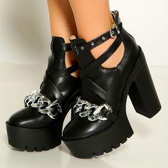 Step out in fierce style with these Black Platform Booties. Featuring chunky heels, cut-out details, and chain embellishments, these buckle ankle boots are a must-have for edgy fashion enthusiasts. Color: Black Heel Type: Chunky heel Heel Height: 4.72" / 120 mm approx Product measurements were taken using size 8. Please note that measurements may vary by size. Toe: Round toe With platform Metal chain embellishment Adjustable buckle strap design Back zipper closure Cut-out design Lug Sole design Handcrafted US sizing. Fits true to size. Edgy Chain Boots For Streetwear, Edgy Chunky Platform Heels, Trendy Chain Boots For Party, Trendy Party Boots With Chain Detail, Edgy Chunky Platform Boots For Party, Edgy Platform Boots With Block Heel, Edgy Chunky Platform Ankle Boot Heels, Edgy Chunky High Heel Platform Boots, Punk Style Party Boots With Block Heel