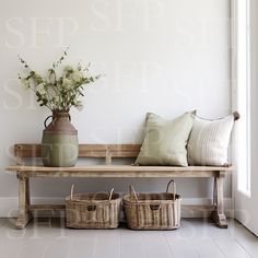 a wooden bench with two baskets on it next to a vase filled with white flowers