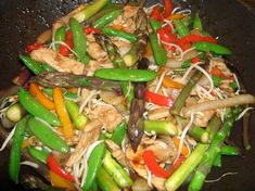 stir fry with chicken and vegetables in a wok