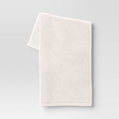 a white towel folded on top of a table