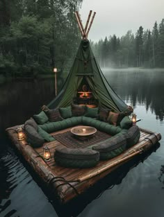 a green tent sitting on top of a wooden raft