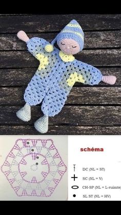 a crocheted doll laying on top of a wooden floor next to a pattern