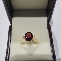 14k solid yellow gold natural oval shaped garnet semi precious gemstone and natural round brilliant cut shaped diamonds ring. 1. The weight of the natural garnet gemstone used in the ring =2.90 cts. 2. The weight of the natural diamonds gemstones used in the ring =0.07 cts. 3. The weight of the 14k solid yellow gold used in the ring =2.300 grms. The garnet is the birthstone for the people born in the month of January. The design of the ring is very nice and beautiful. I am an artist with the exp Oval Ruby Birthstone Ring With Diamond Accents, Oval Ruby Ring With Diamond Accents In 14k Gold, Oval Ruby Ring With Diamond And Gemstone Accents, Oval Garnet Diamond Promise Ring, Oval Garnet Gemstone Diamond Ring, Oval Garnet Rings With Gemstone Accents, Oval Garnet Diamond Ring, Oval Garnet Diamond Ring With Accent Stones, Oval Diamond Birthstone Ring With Gemstone Accents