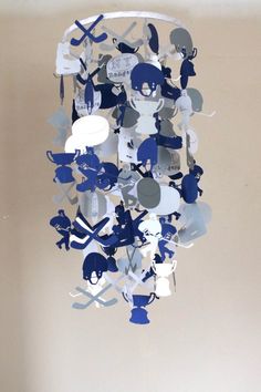 this is a mobile made out of cutouts of baseball players and bats on paper