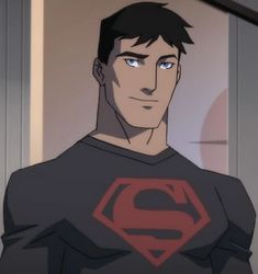 the young man is dressed as superman with blue eyes and a smile on his face