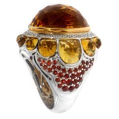 Accessorize with glamor and share you verve with Zorab's 32.49 Carat Citrine Quartz Cocktail Ring. The Center Stone is set in 18 Karat Gold and surrounded by 0.40 carats of white diamonds. Citrine Quartz stones encircle the bombe centerpiece, while 1.60 carats of Red Sapphires add the finishing touches to each side, completing the bold, gleaming effect of this original Zorab masterpiece! This item has a serial number and bears the stamp of authenticity from Zorab Creation. Rings Red, Rebecca Davis, Expensive Rings, Sapphire Cocktail Ring, Red Sapphire, Sapphire Rings, Ring Sapphire, Sparkly Jewelry, Contemporary Ring